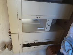 Double bed with head board and side tables with cabinets 