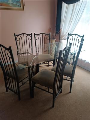 Dining room suit. one glass topp and six chairs. 