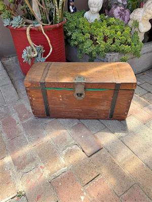 Antique travel kist with domed and steel straps