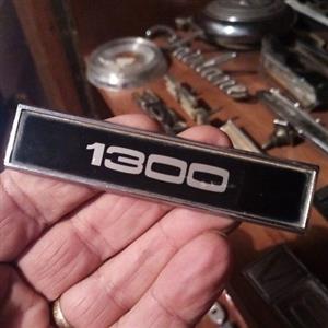 Escort 1300, badge