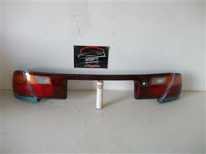 Mazda 323 '94-'98 tail light center garnish