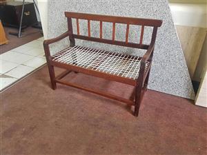 Two seater solid teak riempie bench