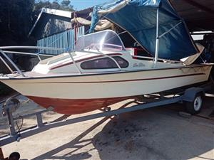 Sea Star Cabin Boat on Trailer