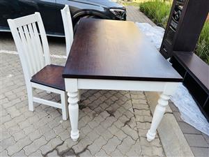 An antique style dining room suite with 6 chairs and a 3 piece side cabinet.