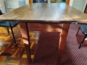 Antique Rhodesian Kiaat dining table and four matching riempie chairs