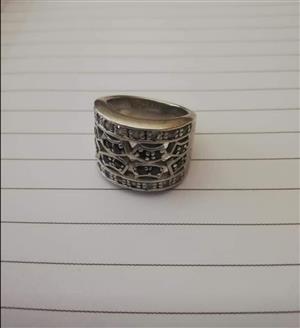 Big silver ring with black and clear zirconia