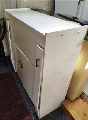Sewing machine storage cabinet