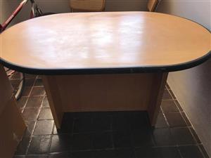 Oval wooden dining table