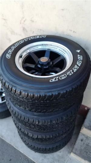 17inch Mags with 265/65/17 Dunlop A/T  85% left on thetyres, (6x139,7pcd) will fit on Ford