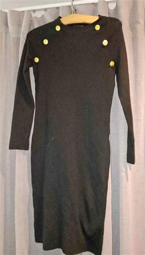 Ladies brand New knitted knee length dress. Size 12.