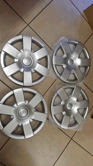TOYOTA QUANTUM 15" AND ANY TOYOTA 15" CAR. PLASTIC WHEEL CAPS. BRAND NEW.