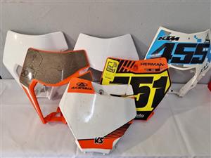 KTM  USED HEADLIGHT COVERS AND NUMBER BOARDS