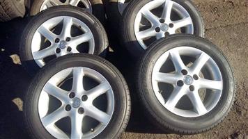 Original set of 15 inch  toyota RunX mags with tyres