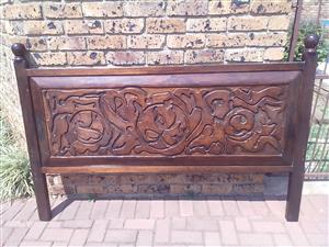 Carved wooden headboard