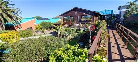 Walking Distance to the Beach with Two Rental Income Generating Flats! in Paradise Beach