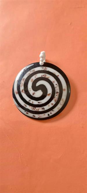 mother of pearl shell spiral pendant.6cm diameter