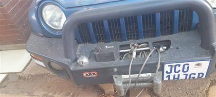 Iron bumper with a winch for sale