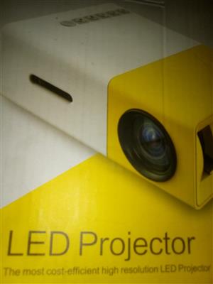 A portable HD LED Projector Laptop Home.