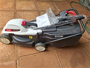 Ryobi Electric lawn mower with all accessory,s, as new only been used two times.