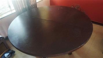 Beautiful round imbuia dining table for sale.