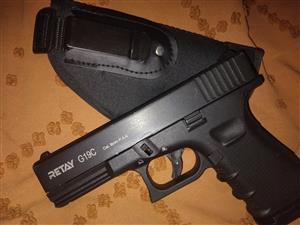 Blank and pepper gun