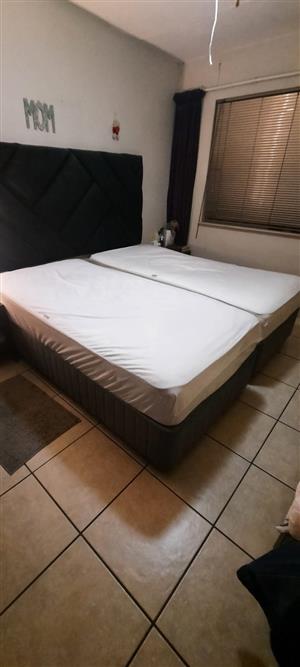Two single beds, with mattress protectors and toppers
