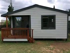 Nutec house and log cabin