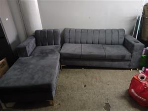 Charcoal grey L shape couch with coffee table