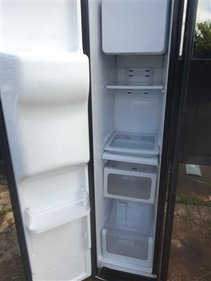 Samsung side by side Mirror fridge with water and ice dispenser for sale.