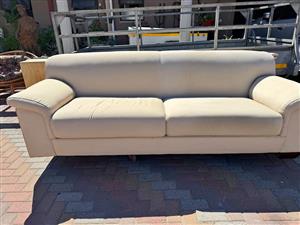 Beige two seater sofa