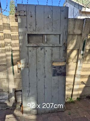 Vintage timber prison cell door