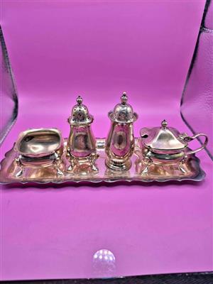 Vintage silver-plated cruet set, also known as a condiment set.