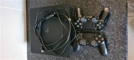 Sony PS4 1 TB hardrive + 2 Remotes 