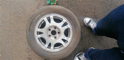 I am selling a set of Audi A4 Aluminium Rims+fair condition tyres