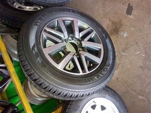 18" Toyota Hilux/Fortuner mag with brand new 265/60/18 Dunlop Grandtrek A/T to use for spare 