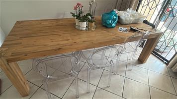 8 Seater wood dining room with 8 chairs.