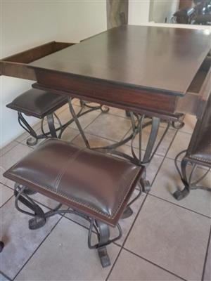 A Stylish Wrought Iron Dining Room Suit