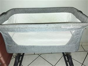 BARGAIN: SNUGGLETIME CO-SLEEPER BABY COT WITH ADDED EXTRAS AT HALF PRICE.