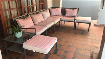 PATIO SET. 8 PIECE. Aluminium frame with artificial wicker seating. 5 x chairs (can be combined or separate) 2 x ottomans (or seats) & 1 x side (coffee) table