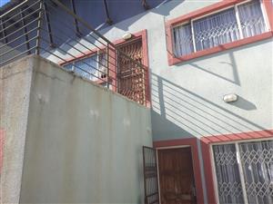 Three bedroom townhouse, garage, three carports and backup Jojo tanker