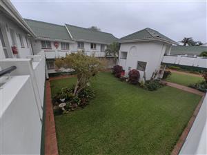 Lovely corner flat in central Retirement complex with distant sea view