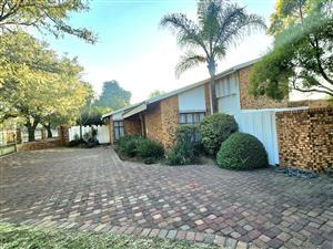 Spacious 4-Bedroom Home with 3 Living Areas & 3 Garages.