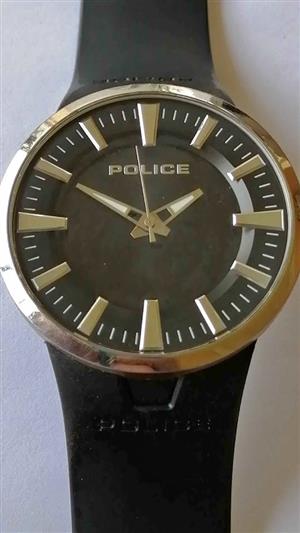 Police wrist watch, requires new battery.