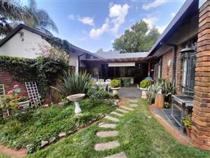 Versatile Amandasig Home with Log House, Borehole, and Entertainment Spaces