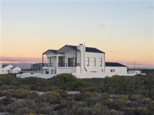 Coastal Luxury Redefined – Designer Beachfront Home with Panoramic Ocean Views