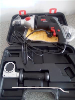 Brand new 900W Skil hammer and rotary drill in carrybox