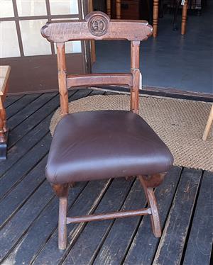 Beautiful, antique, carved monastery chair with leather seat
