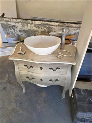 Small vanity, complete with basin and Hansgrohe tap.