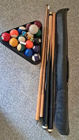 2 pool cues and balls