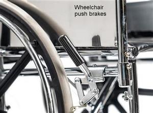 Wheelchair push to lock brakes